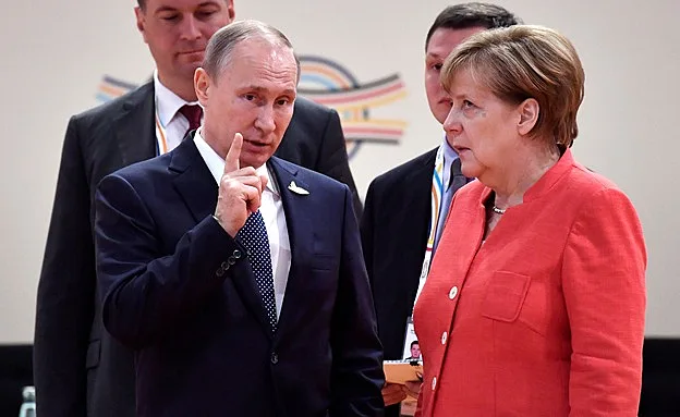 לא מרוצה מהתשובה, מרקל ופוטין (רויטרס)