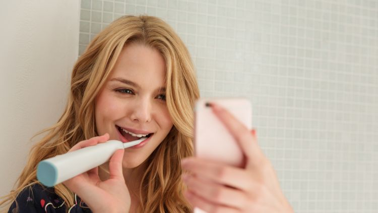 Woman Brushing Teeth, Taking Selfie