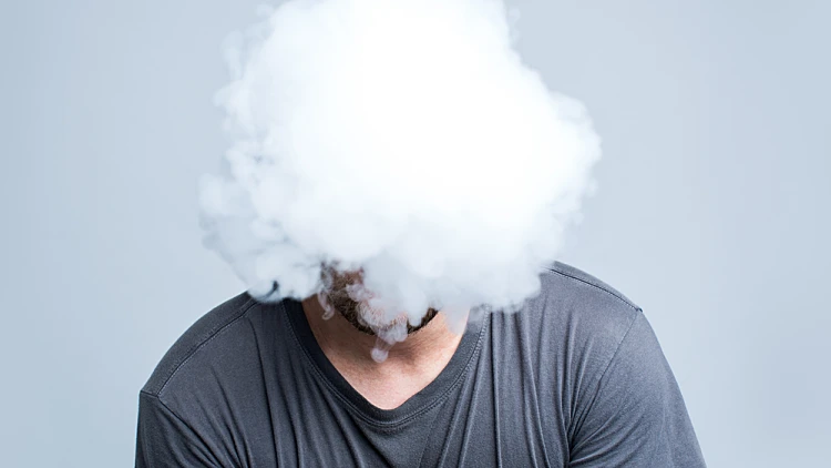 Face,covered,with,thick,white,smoke,isolated,on,light,background