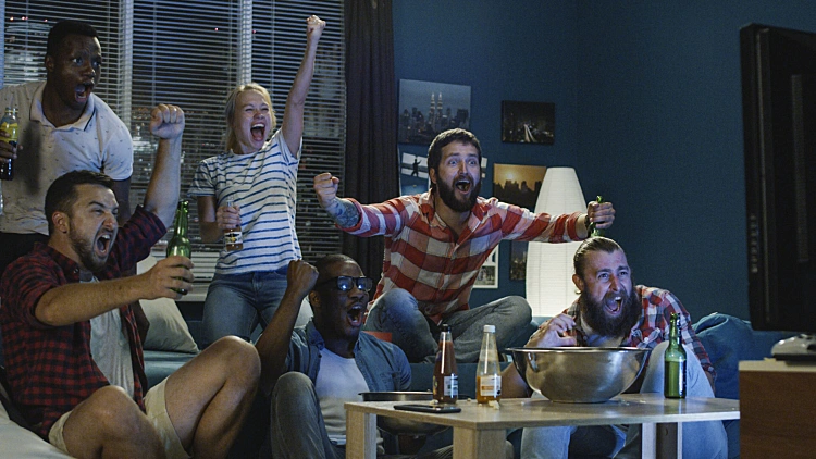 Excited Fans Cheering For Sport Team Watching Game