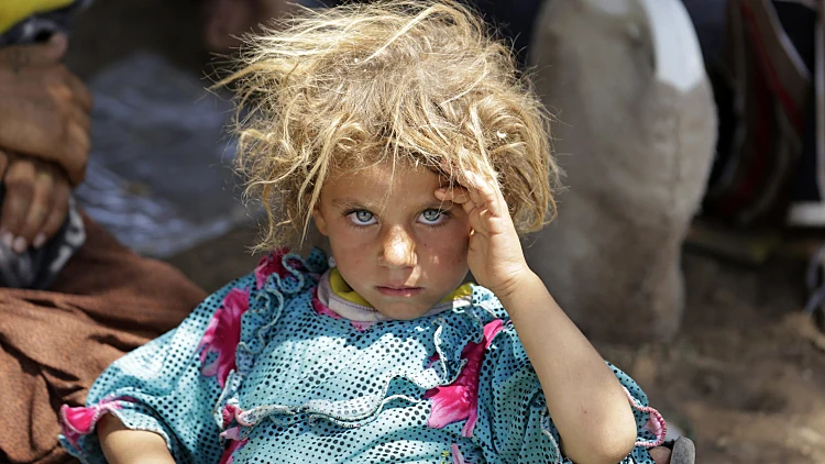ילדה יזידית נמלטת מאזורי העימות בעיראק