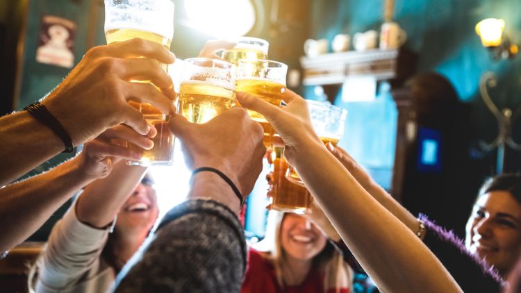 Group,of,happy,friends,drinking,and,toasting,beer,at,brewery