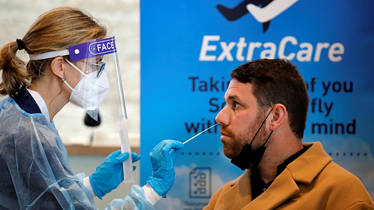 A Health Worker Takes The Antigen Test Which Takes 15 Minutes To Deliver Results And Is Considered Reliable For Detecting Active Coronavirus Disease (covid 19) Infection, An El Al Spokesman Said, At Ben Gurion International Airport In Lod