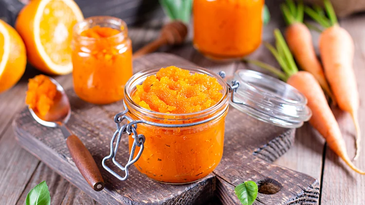 Carrot,jam,with,orange,juice,in,a,glass,jar,on