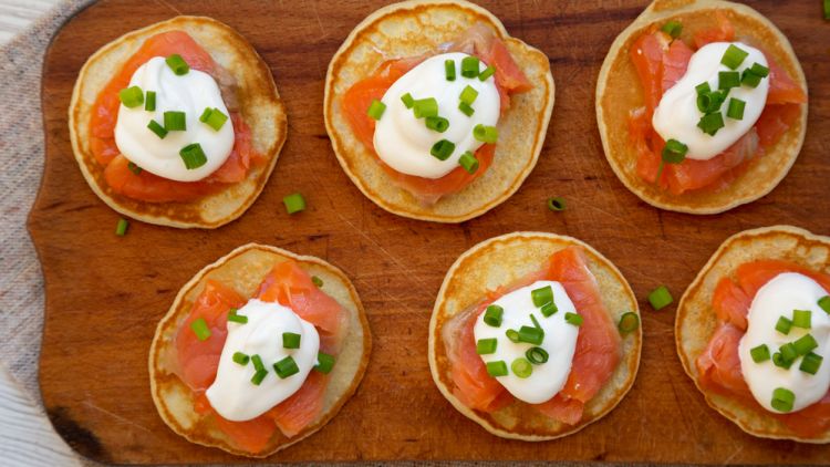 Homemade,blini,with,smoked,salmon,,creme,and,chives,on,a