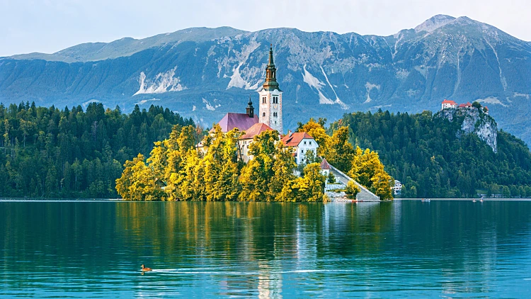 Sunrise,view,on,bled,lake,,island,church,and,castle,with,mountain