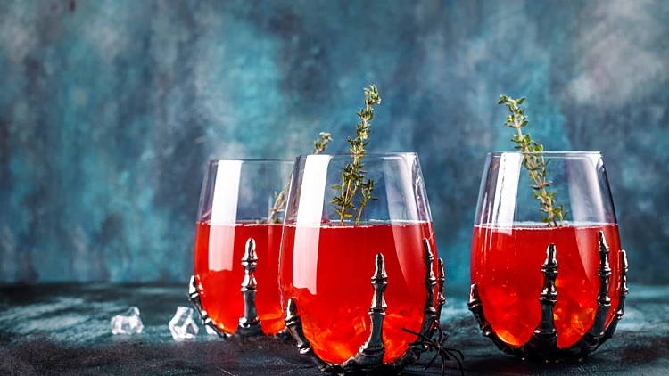 Bloody,halloween,party,cocktail,garnished,with,thyme,,cranberry,punch,for