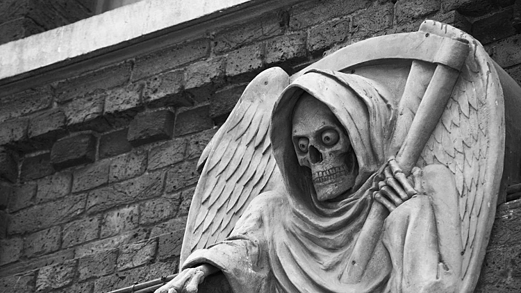 הצינוק של לונדון Photo,of,a,death,statue,outside,the,london,dungeon,,uk