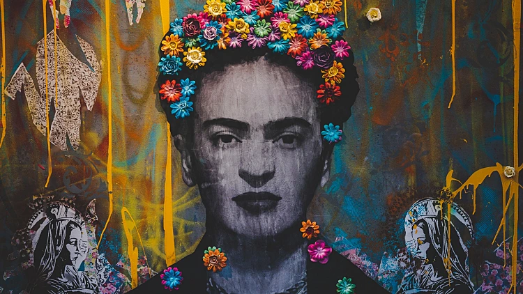 Creative graffiti wall with portrait of Frida Kahlo