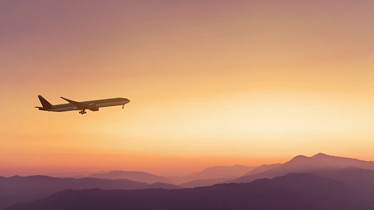 Travel,concept,background,,airplane,in,sunset,sky,,international,flight