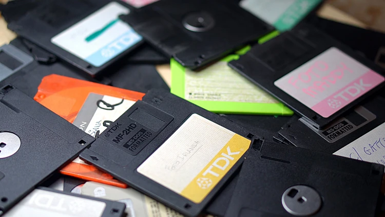 Scattered,floppy,disks,of,different,colors.,digital,media,on,magnetic