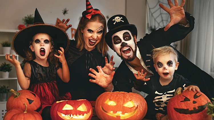 Happy,family,mother,father,and,children,in,costumes,and,makeup