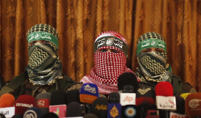 דובר הזרוע הצבאית של חמאס, אבו עוביידה, במסיבת עיתונאים (ארכיון)