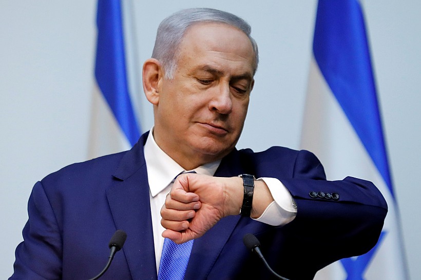 Israeli Prime Minister Benjamin Netanyahu Looks At His Watch Before Delivering A Statement At The Knesset, Israel's Parliament, In Jerusalem