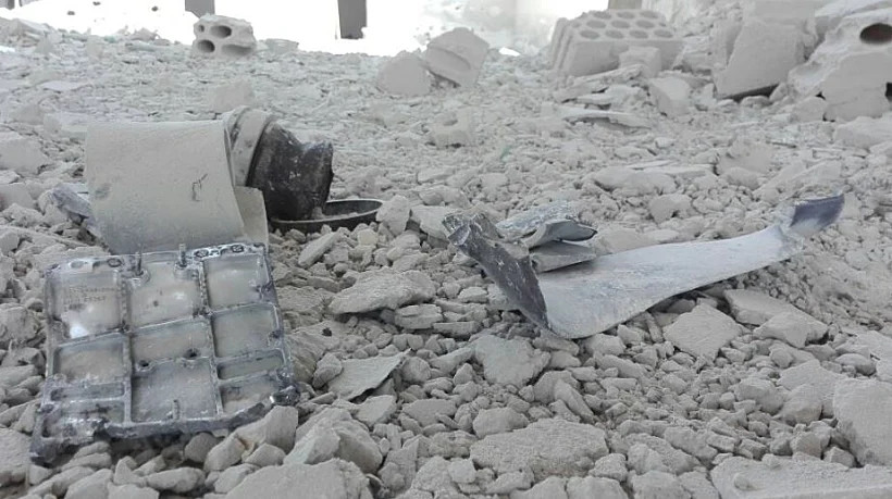 שרידי הטילים שפגעו באתר שהופצץ בפרברי חלב