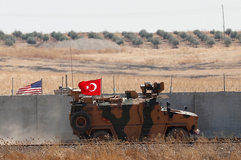 A Turkish Military Vehicle Returns After A Joint U.s. Turkey Patrol In Northern Syria, As It Is Pictured From Near The Turkish Town Of Akcakale