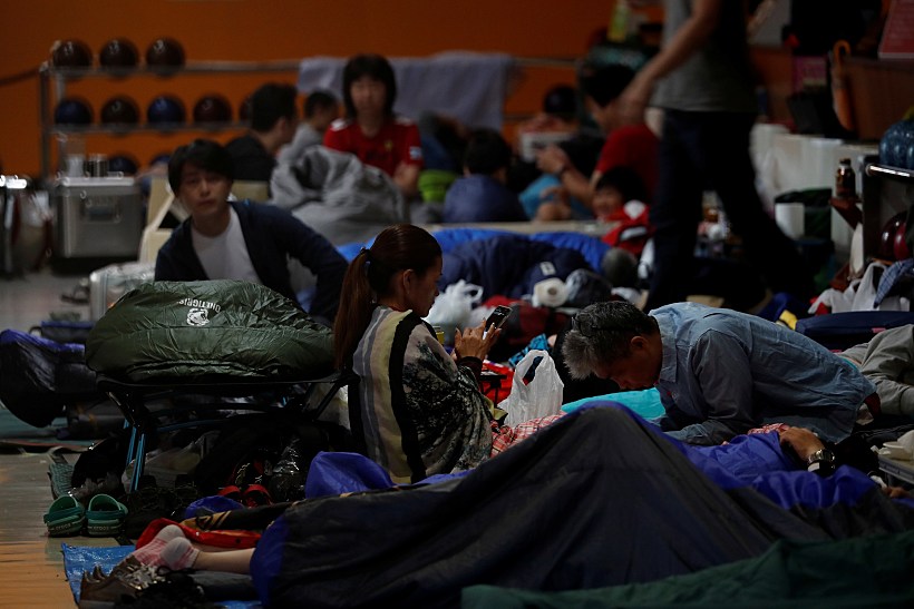 Spectators Who Evacuate From Typhoon Hagibis, Gather At A Makeshift Accommodation For Spectators Of Formula One Japanese Grand Prix At Suzuka Circuit In Suzuka