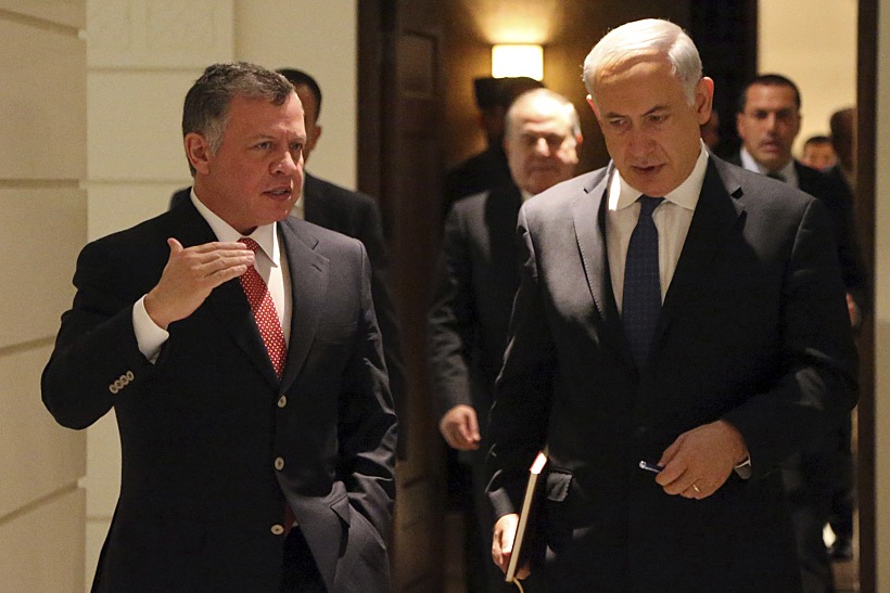 Jordan's King Abdullah Walks With Israel's Prime Minister Netanyahu Before Their Meeting At The Royal Palace In Amman