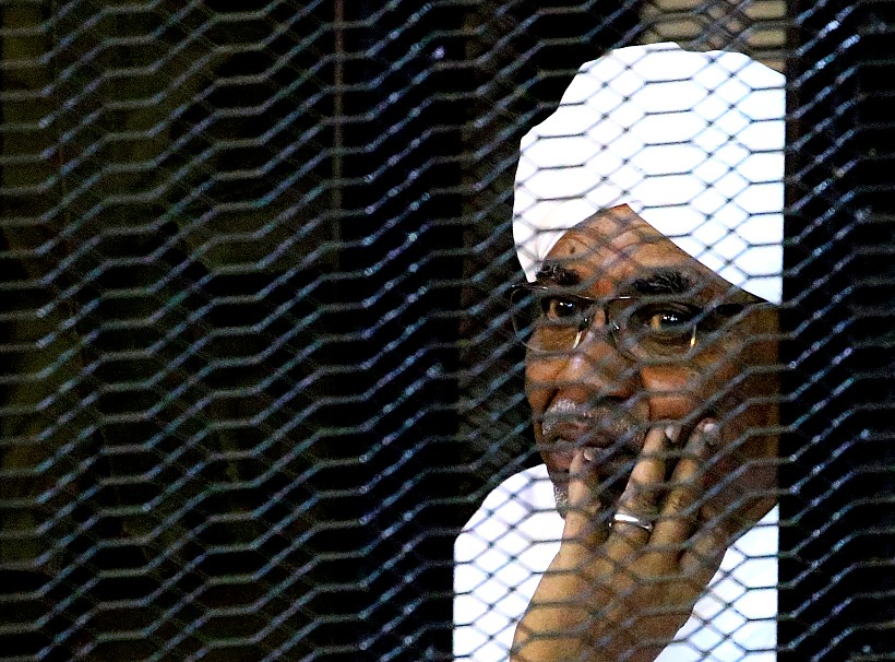 Sudan's Former President Omar Hassan Al Bashir Sits Inside A Cage At The Courthouse Where He Is Facing Corruption Charges, In Khartoum