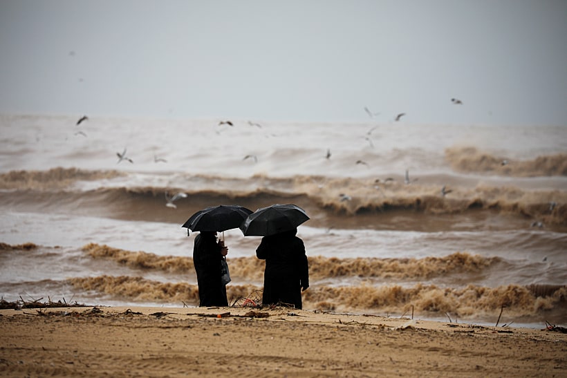 Ultra Orthodox Jewish Men Hold Umbrellas And Look At The Mediterranean Sea As Heavy Rainfalls Hit Israel, In Ashdod, Israel