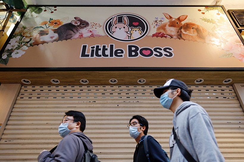 People Stand In Front Of A Closed Pet Shop After The Government Announced To Euthanize Around 2,000 Hamsters In The City After Finding Evidence For The First Time Of Possible Animal To Human Transmission Of Coronavirus Disease (covid 19) In Hong Kong