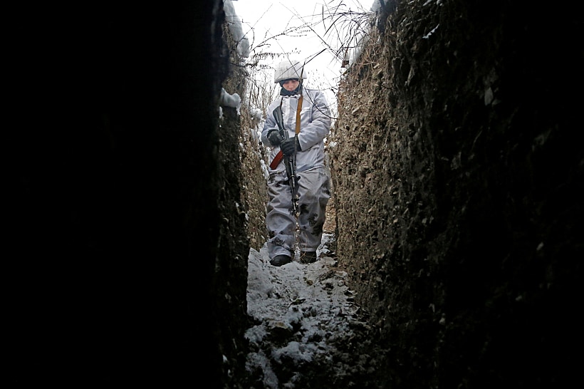 A Militant Of The Self Proclaimed Luhansk People's Republic Walks In A Trench At A Fighting Position In Luhansk Region