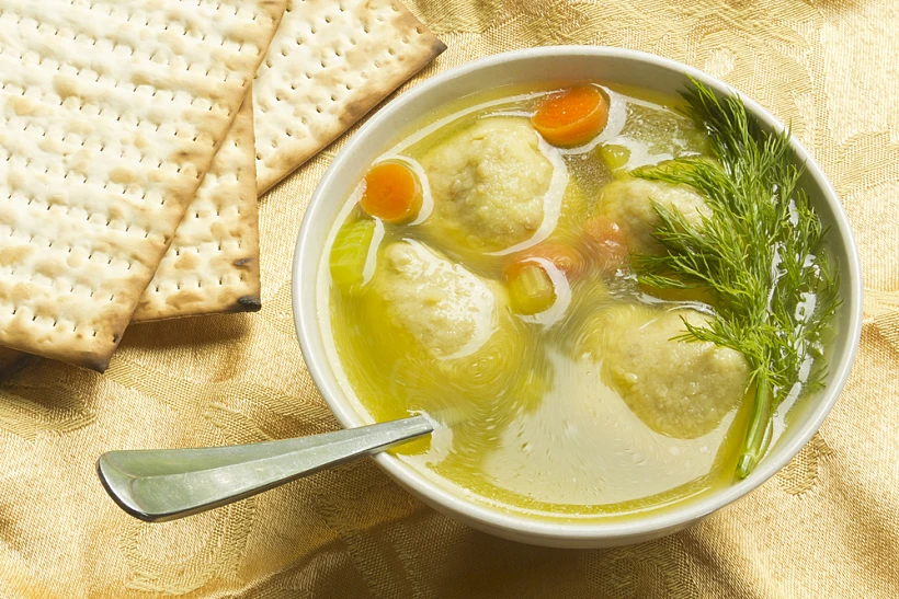 Delicious,matzoh,ball,soup,with,crackers,wine,and,dill