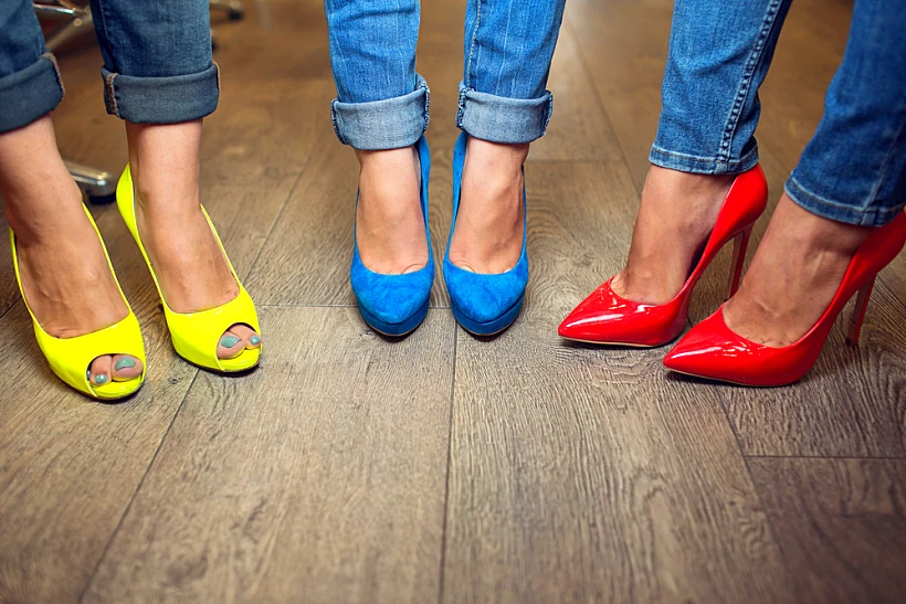 Yellow,blue,red,shoes,on,female,feet
