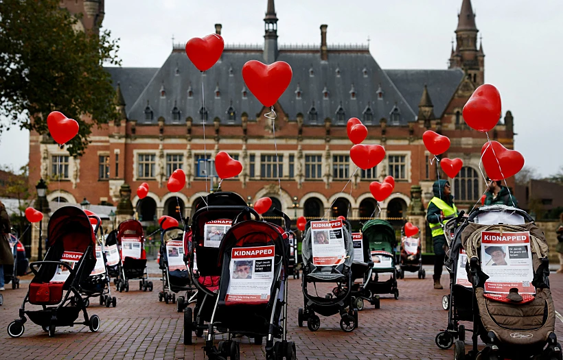 Strollers With Pictures Of Kidnapped Children Are Placed By Protesters In Front Of The Seat Of The United Nations World Court In The Hague