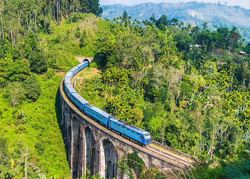 Blue,train,on,nine,arches,bridge,near,ella,in,sri