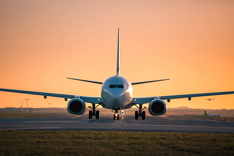 Traffic,at,airport,at,golden,sunset.,front,view,of,taxiing