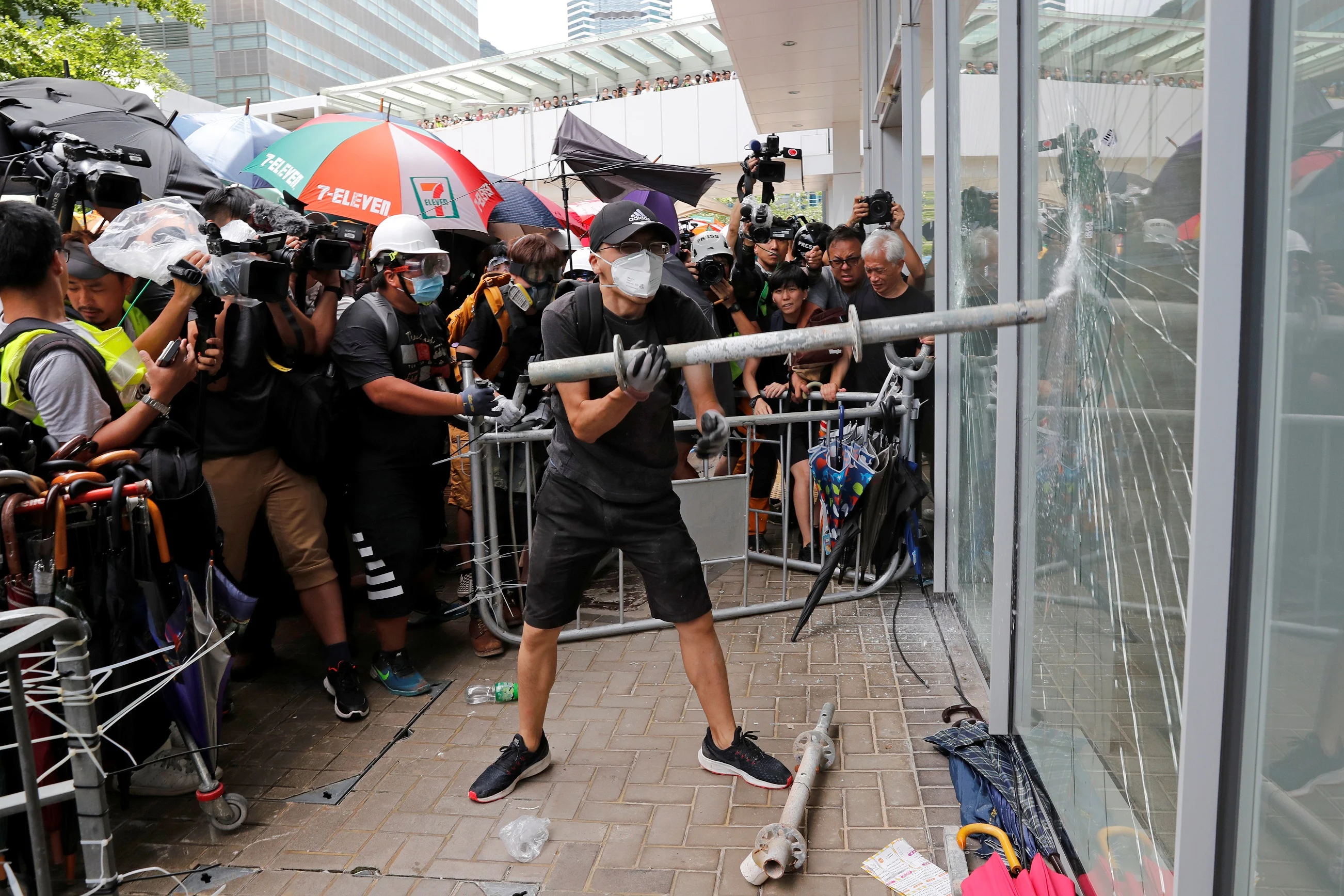 Protesters Try To Break Into The Legislative Council Building Where Riot Police Are Seen, During The Anniversary Of Hong Kong's Handover To China In Hong Kong