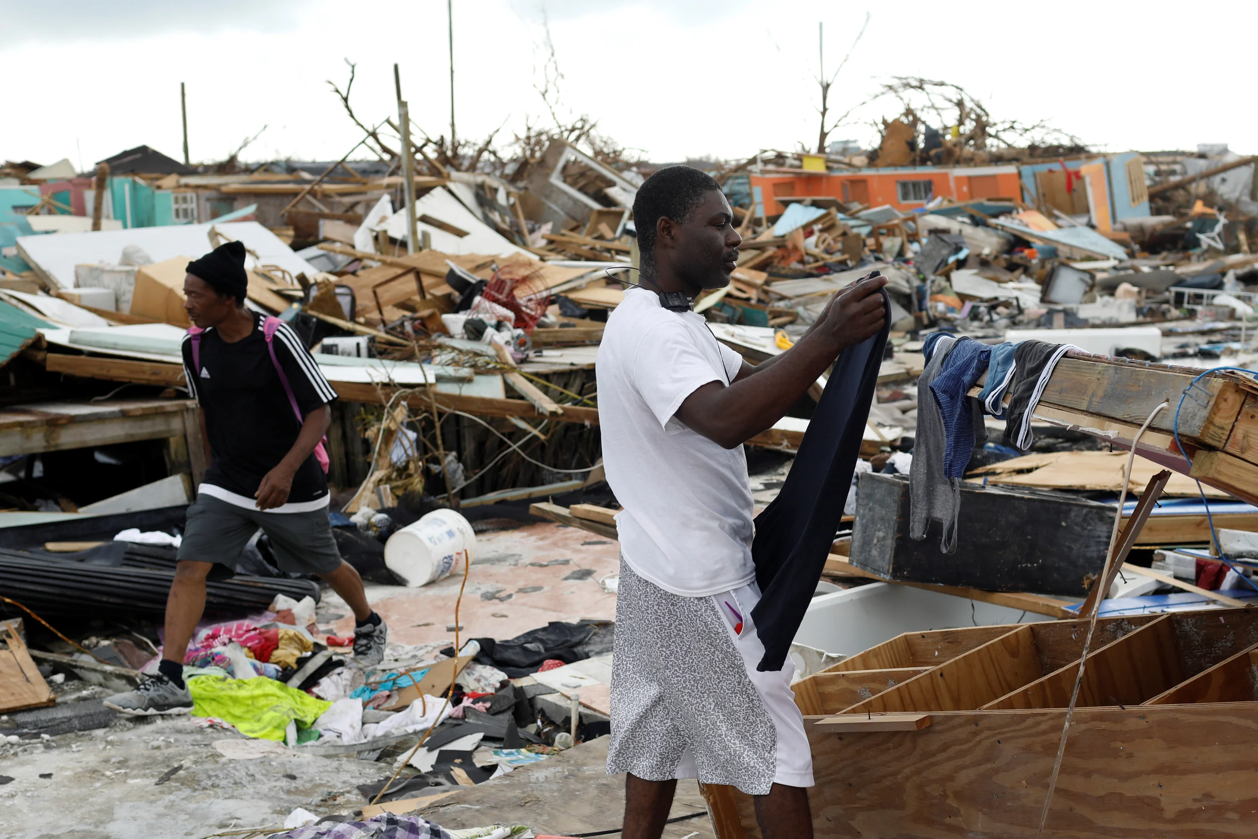 A Man Hangs His Clothes After Washing Them At The Mudd Neighborhood, Devastated After Hurricane Dorian Hit The Abaco Islands In Marsh Harbour