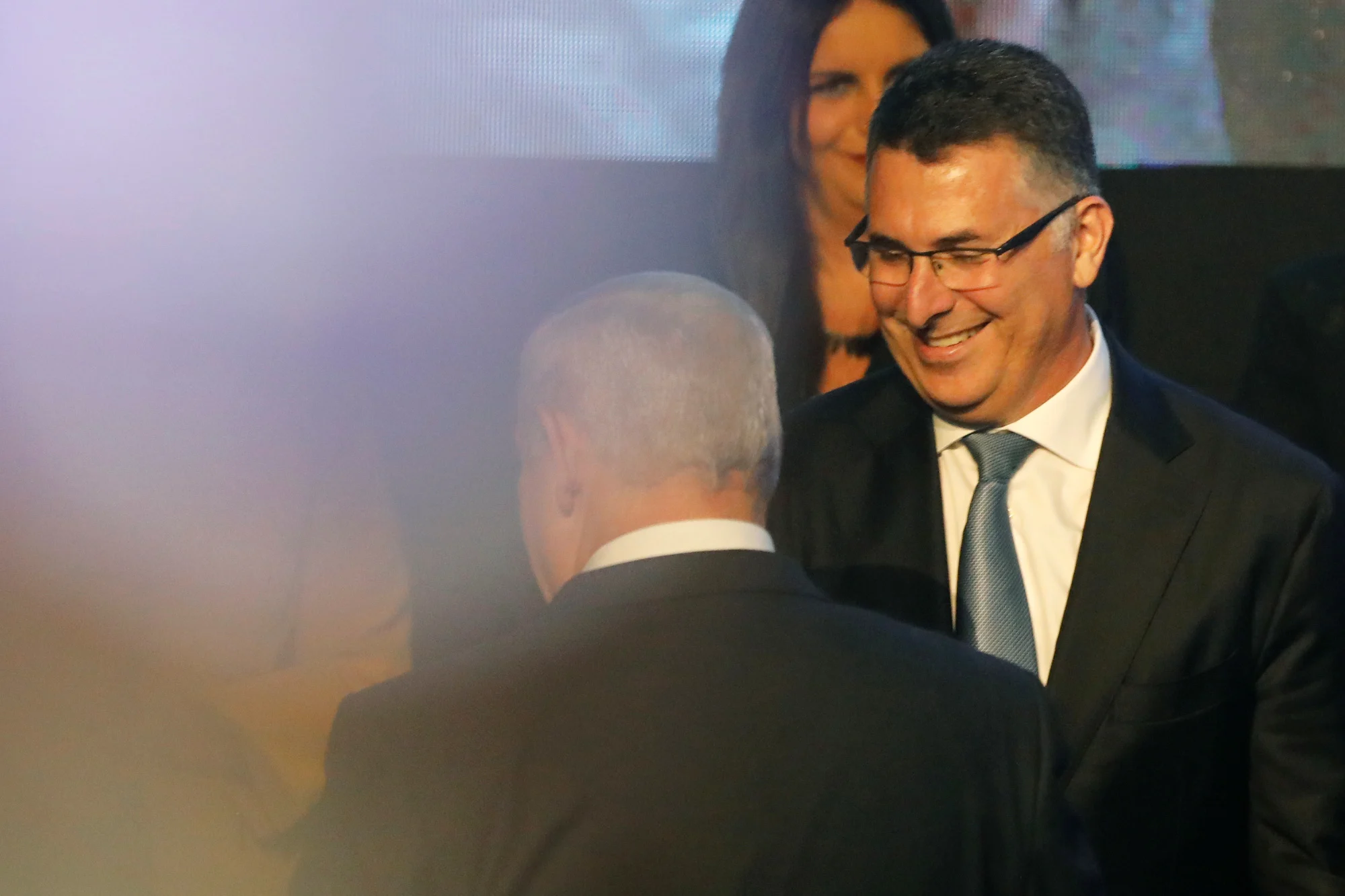 Likud Party Member Gideon Saar, Smiles As Israeli Prime Minister Benjamin Netanyahu Walks Nearby After Addressing Members Of His Right Wing Party Bloc At A Conference In Tel Aviv, Israel