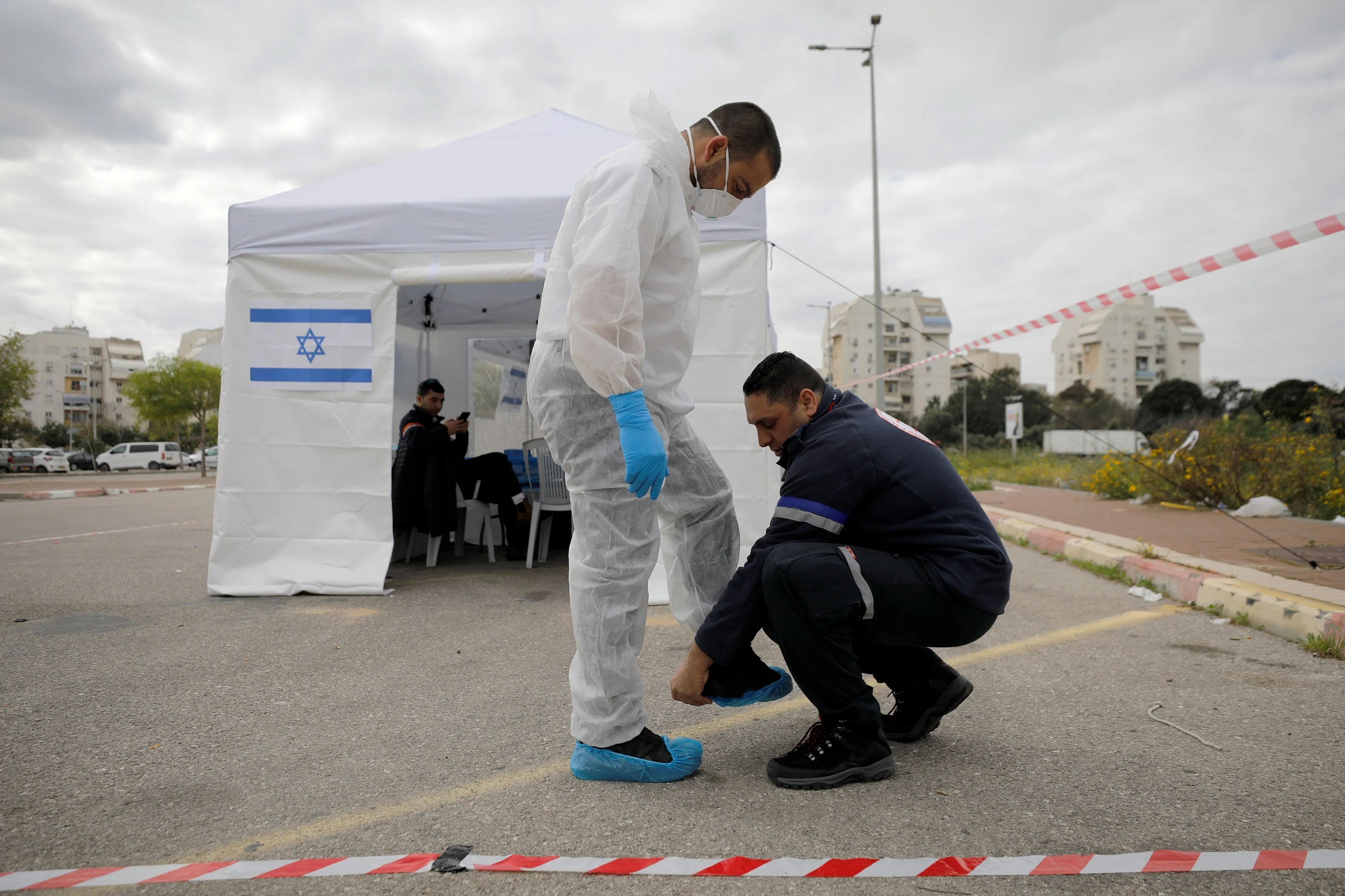A Paramedic Wears A Protective Suit As He Prepares In Front A ''sterile'' Polling Station Set Up By Israel's Election Committee So Israelis In Isolation Over Coronavirus Concerns Will Be Able To Vote In The National Election, In Ashkelon, Israel