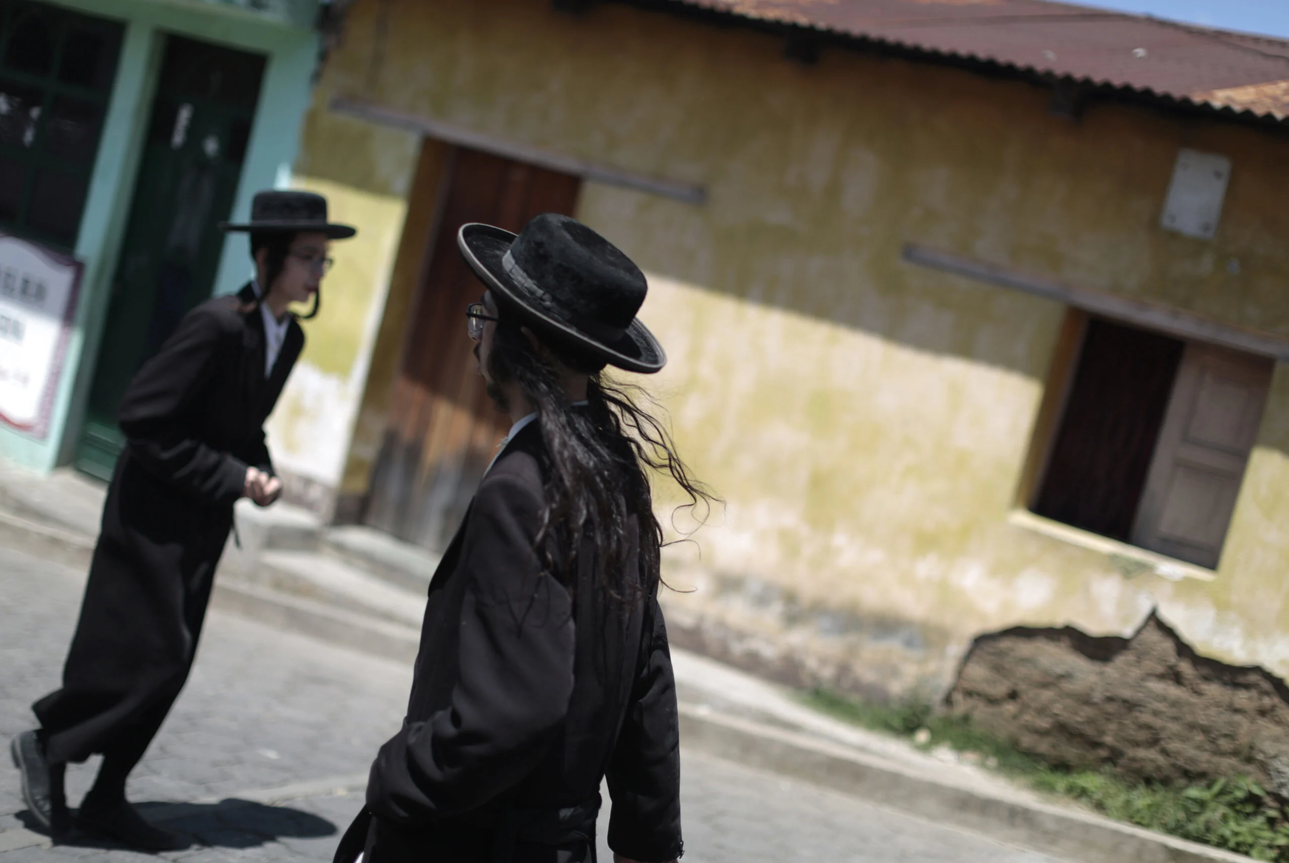 Members Of A Jewish Community Walk In The Village Of San Juan La Laguna