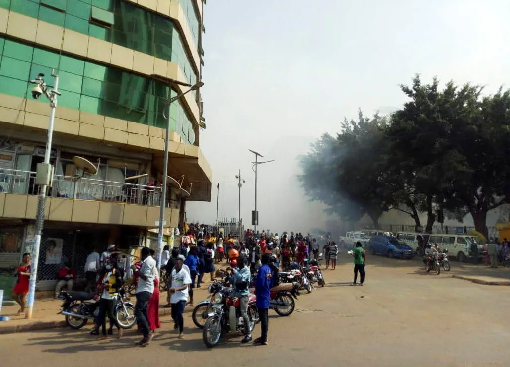 A View Shows Smoke And Motorcycle Taxis Near The Scene Of A Blast In Kampala
