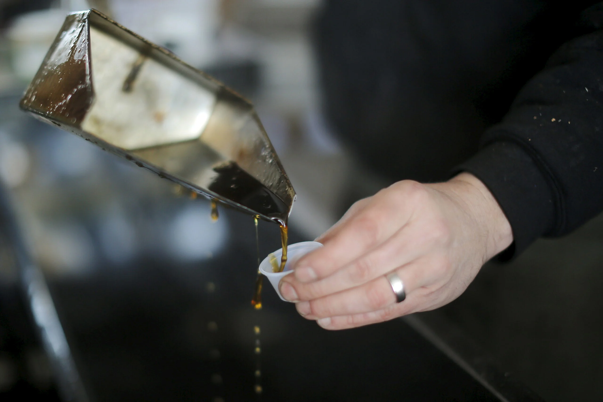 Randle Pours A Sample Of Maple Syrup Just Out Of The Evaporator At Hollis Hills Farm In Fitchburg