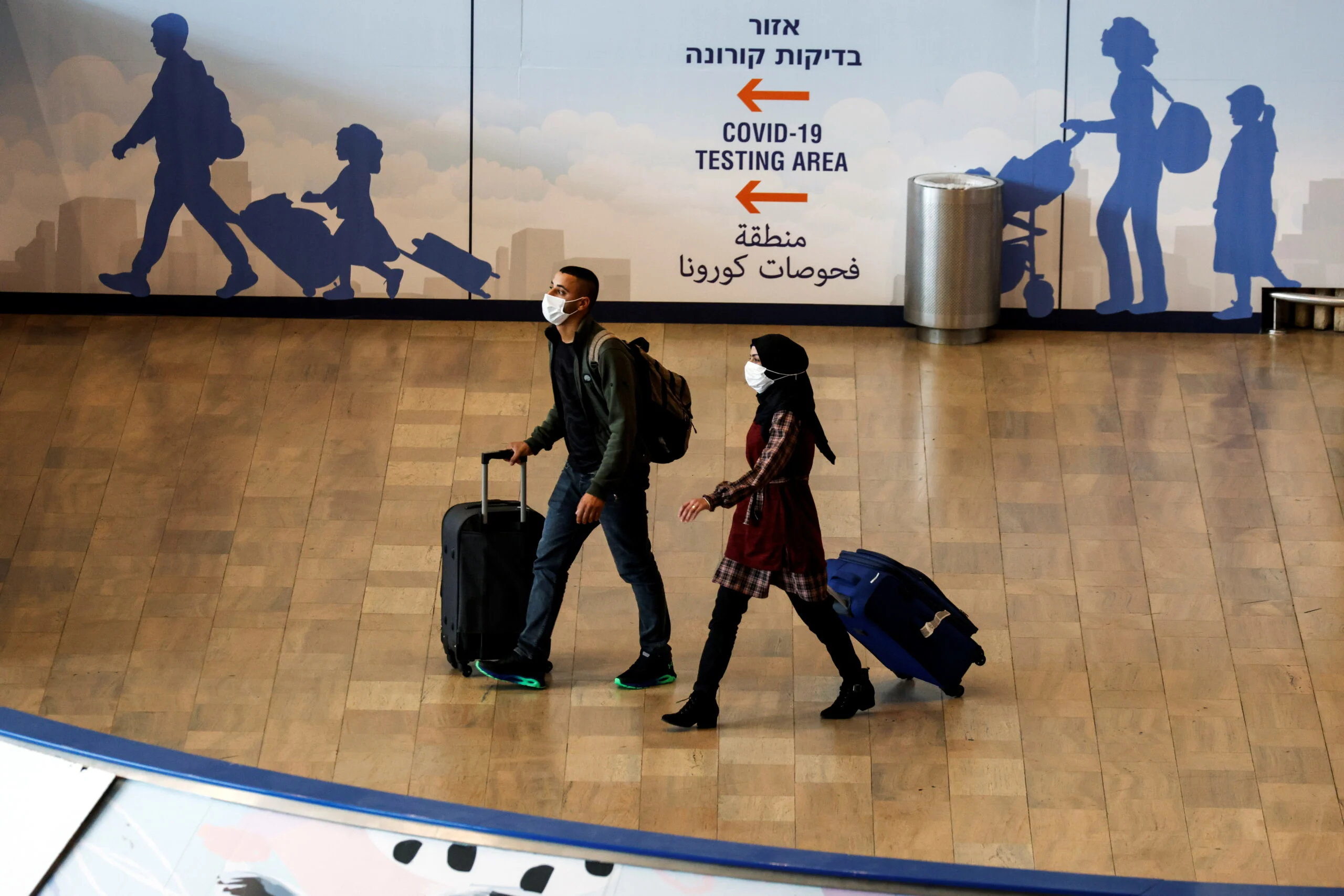 Travellers Walk Towards The Coronavirus Disease (covid 19) Pandemic Testing Area At Ben Gurion International Airport