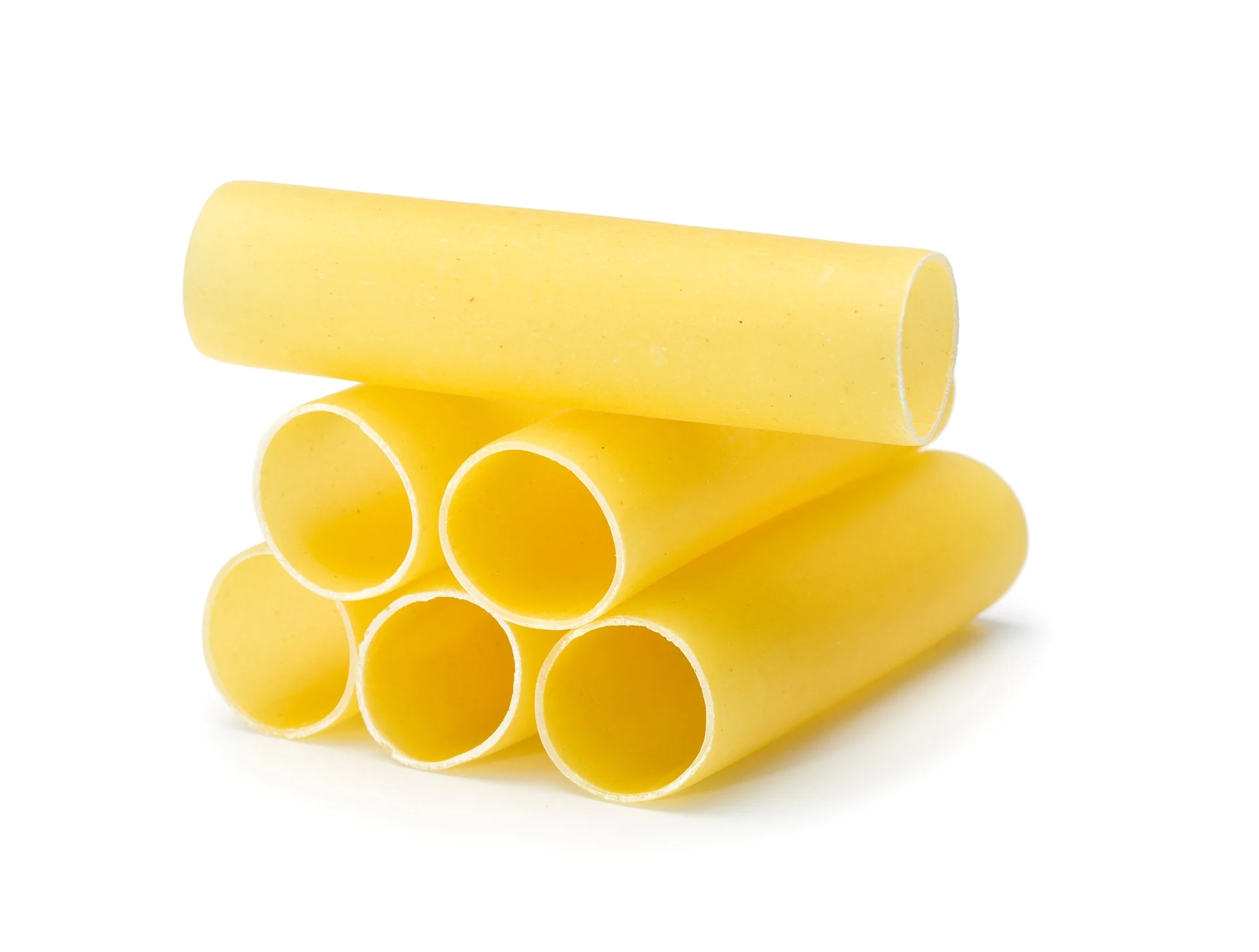 Six,raw,cannelloni,pasta,tubes,stacked,,isolated,on,white