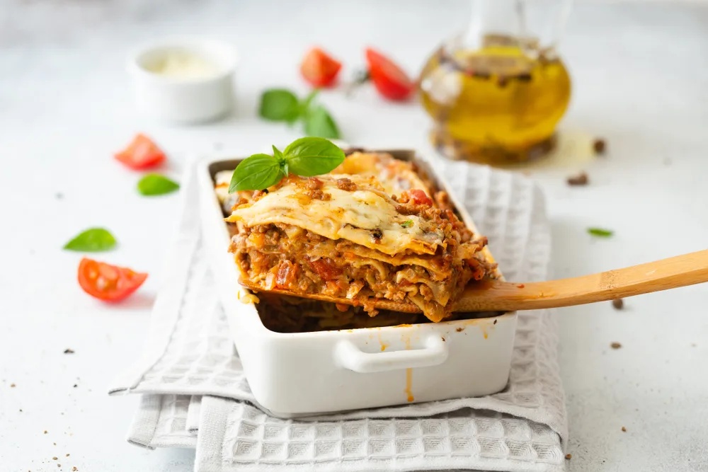 Tasty,lasagne,with,meat,,cheese,on,white,plate
