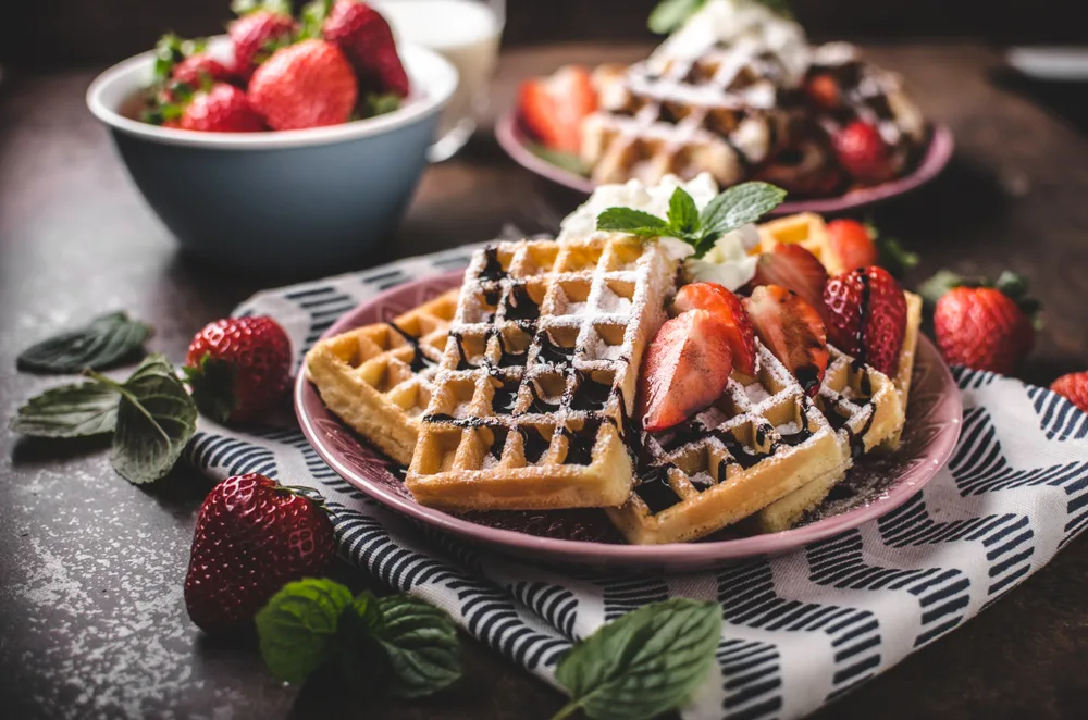 Waffles,with,berries,,strawberries,,chocolate,on,top,and,mint